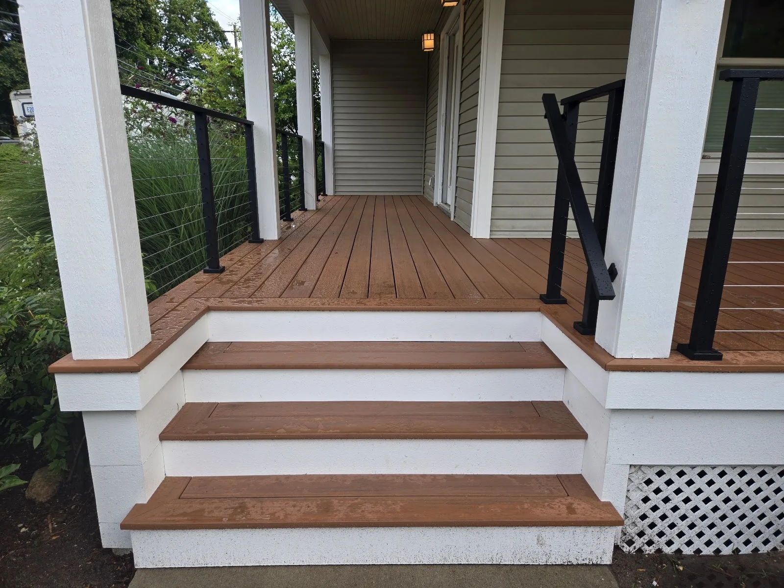 Composite deck stairs with railing in Central Lake Township