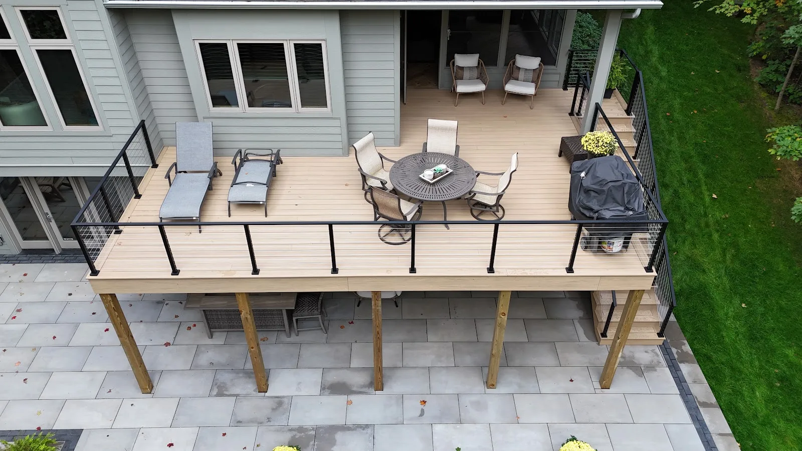 Composite deck with black railing in Ellsworth Township MI