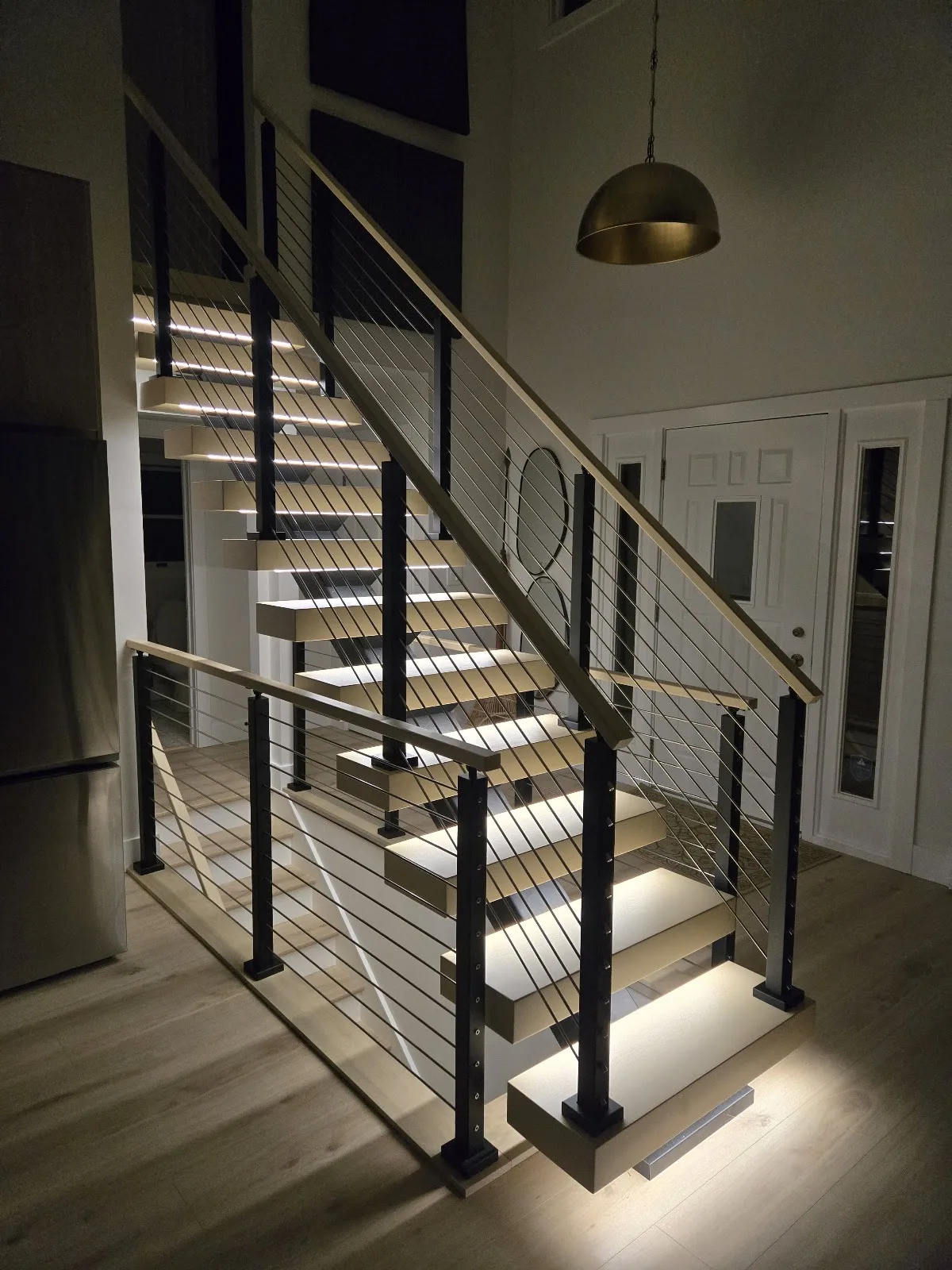 Floating staircase with cable railing in Ellsworth Township MI