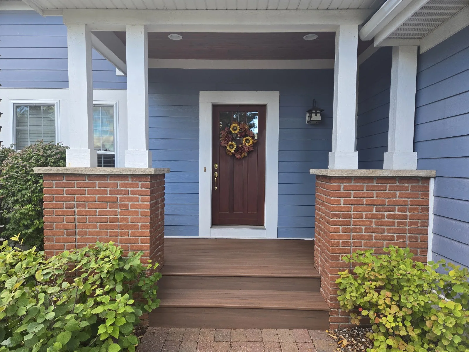 Front porch with brick pillars in Ellsworth Township MI