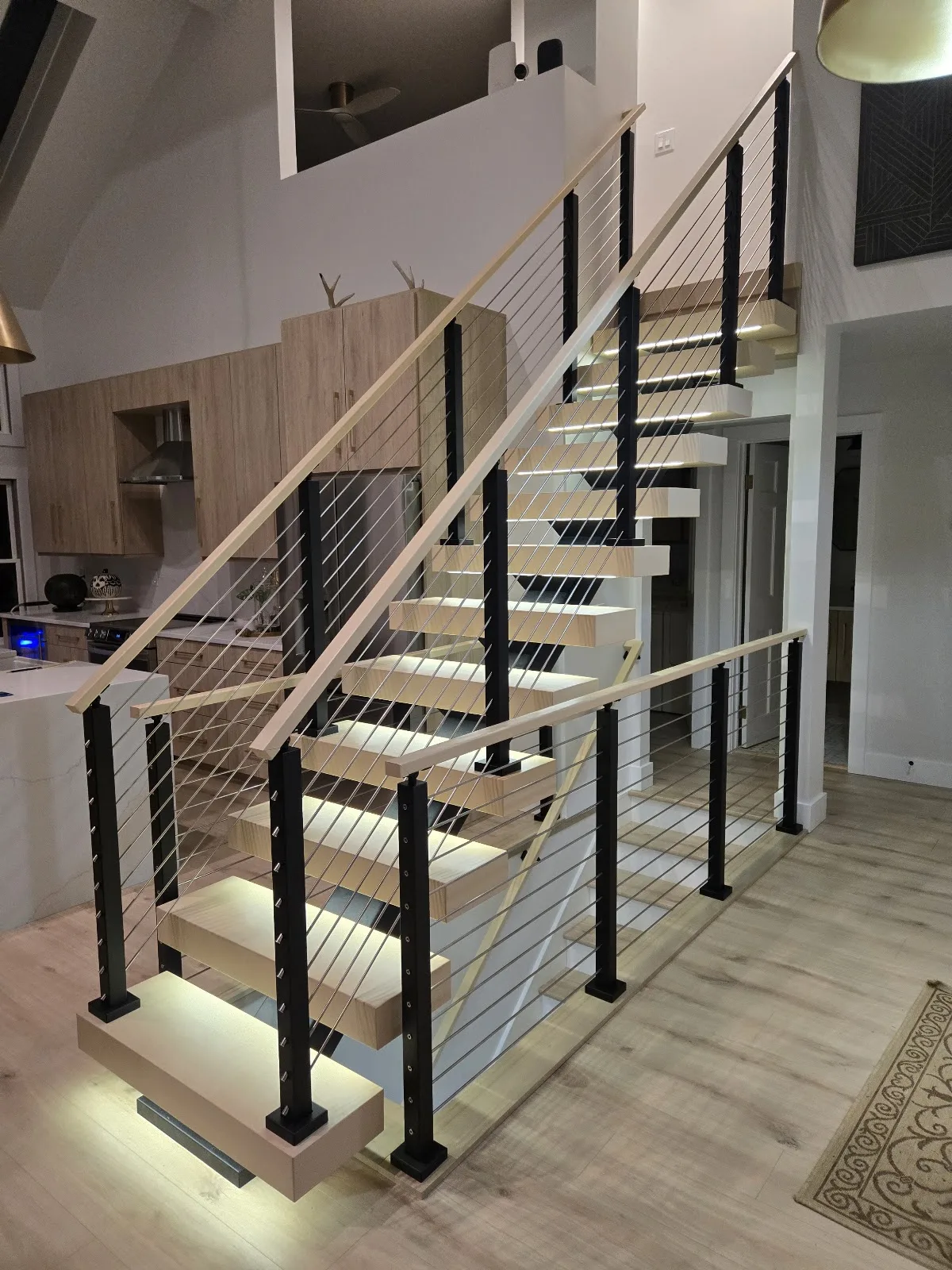 Modern cable railing staircase built for residential deck in Banks Township MI